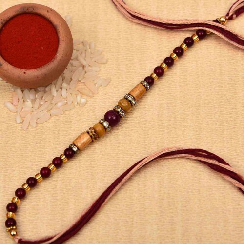 Elegant golden and brown beads rakhi