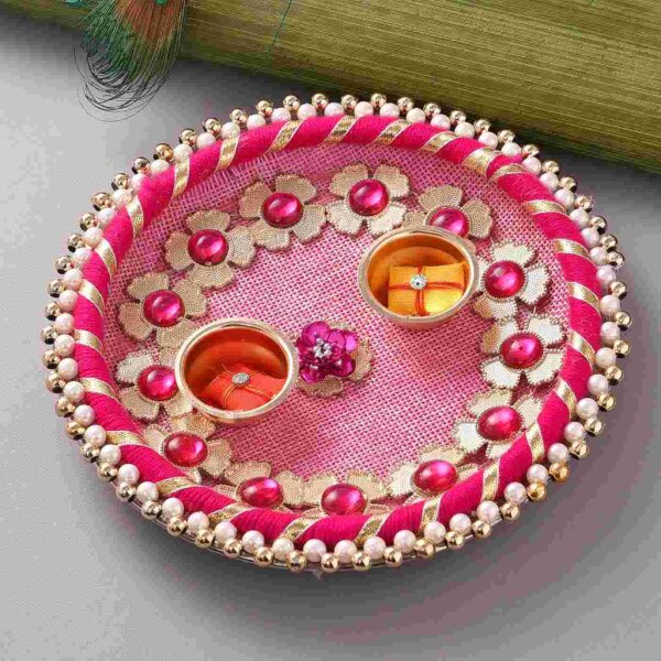 Orange Beads & Pearl rakhi with Batisa slice and Pink thali.