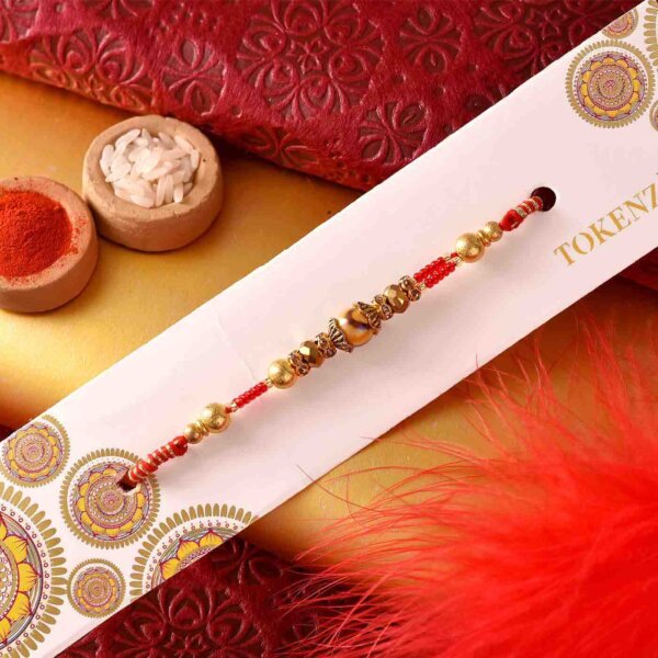 Mewa Bite with Lovely Golden Beads Rakhi