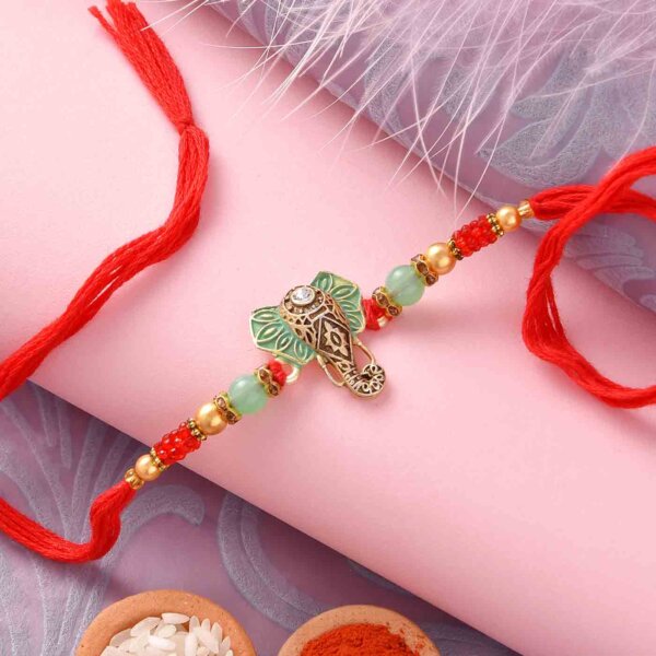 Pista Roll with Designer Ganesha Face and Beads Rakhi- FOR USA