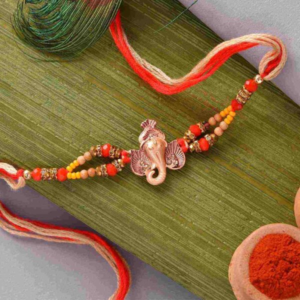Metal Ganesha with double strand beaded Rakhi with Batisa Slice and thali