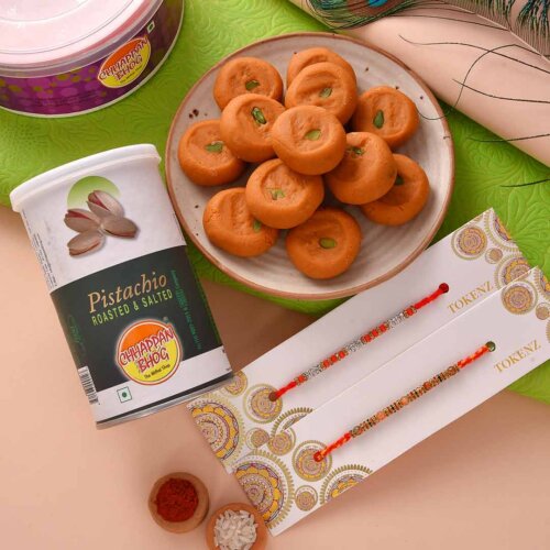 Get delicious kesar peda and roasted pistachio with beautiful beads rakhi Set.