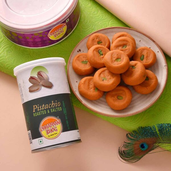 Get delicious kesar peda and roasted pistachio with beautiful beads rakhi Set.