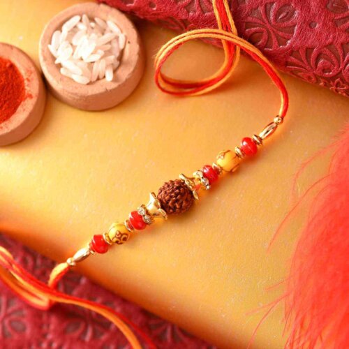 Traditional rudraksh with yellow and red pearl Rakhi