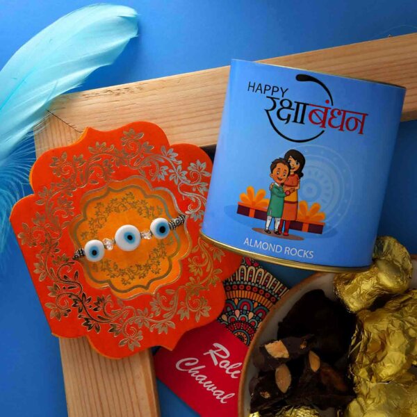 Blue Evil-Eye Rakhi With A Handmade Chocolate Almond Rocks Can (100 Gms)- FOR USA