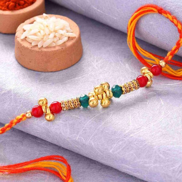 Colorful Pearls Rakhi With Golden Work
