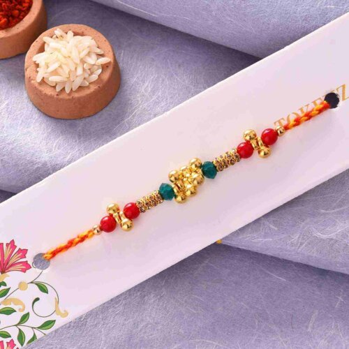 Colorful Pearls Rakhi With Golden Work