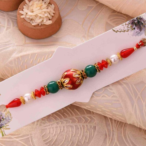 Conventional Red Pearl Rakhi With Dual-Toned Thread