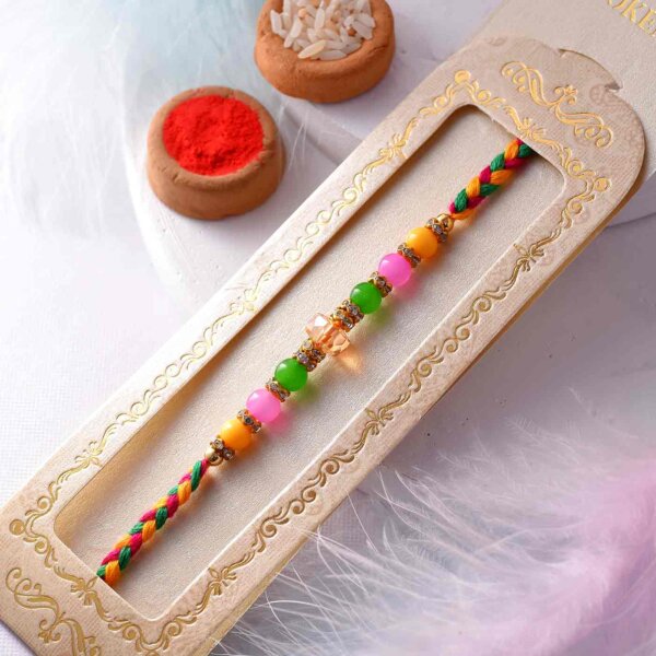 Colorful Pearls Rakhi With A Multi-Toned Thread