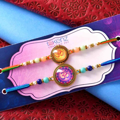 Set Of 2 OM Rakhis With Colorful Pearls