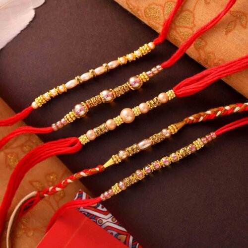 Set Of 5 Golden Beads Rakhis On A Red Thread