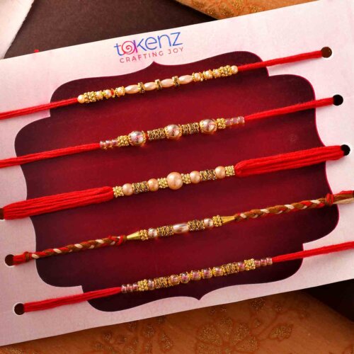 Set Of 5 Golden Beads Rakhis On A Red Thread