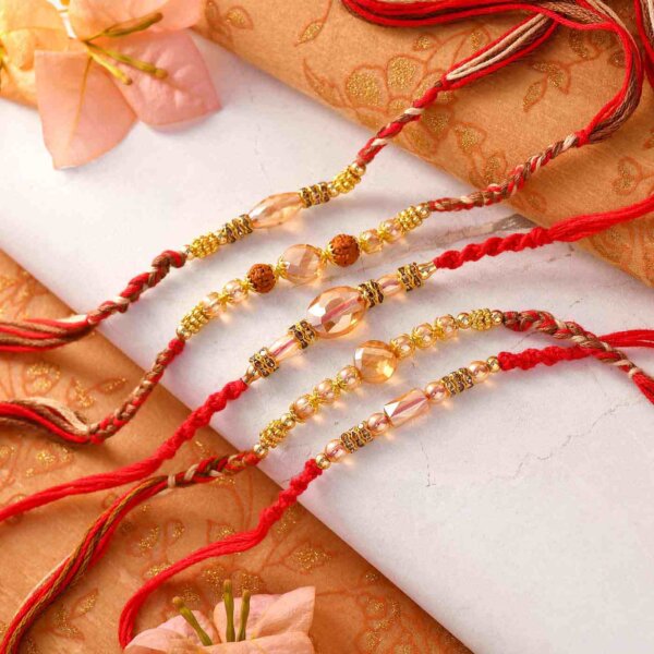Set Of 5 Golden Pearl Rakhis With Interlaced Thread
