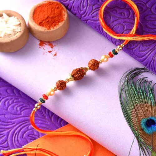 3 Rudraksha Seeds Rakhi In A Multi-Toned Thread