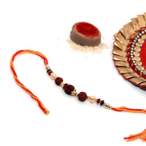 3 Rudraksha Seeds Rakhi In A Multi-Toned Thread