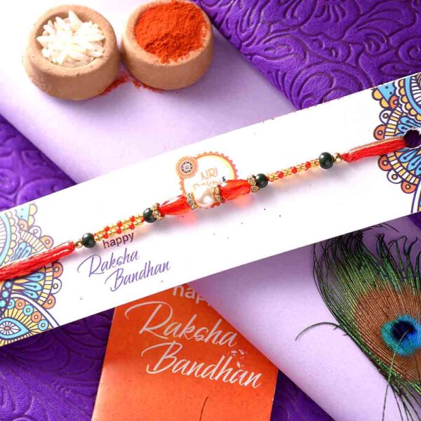 Silver Pearl Rakhi With A Dual-Toned Thread