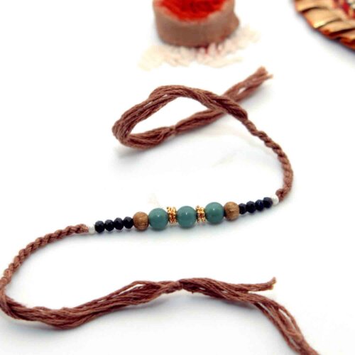 Blue & Black Beads Rakhi With A Brown Thread