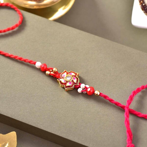 Red Floral Rakhi with 12 pcs. Assorted Sweets