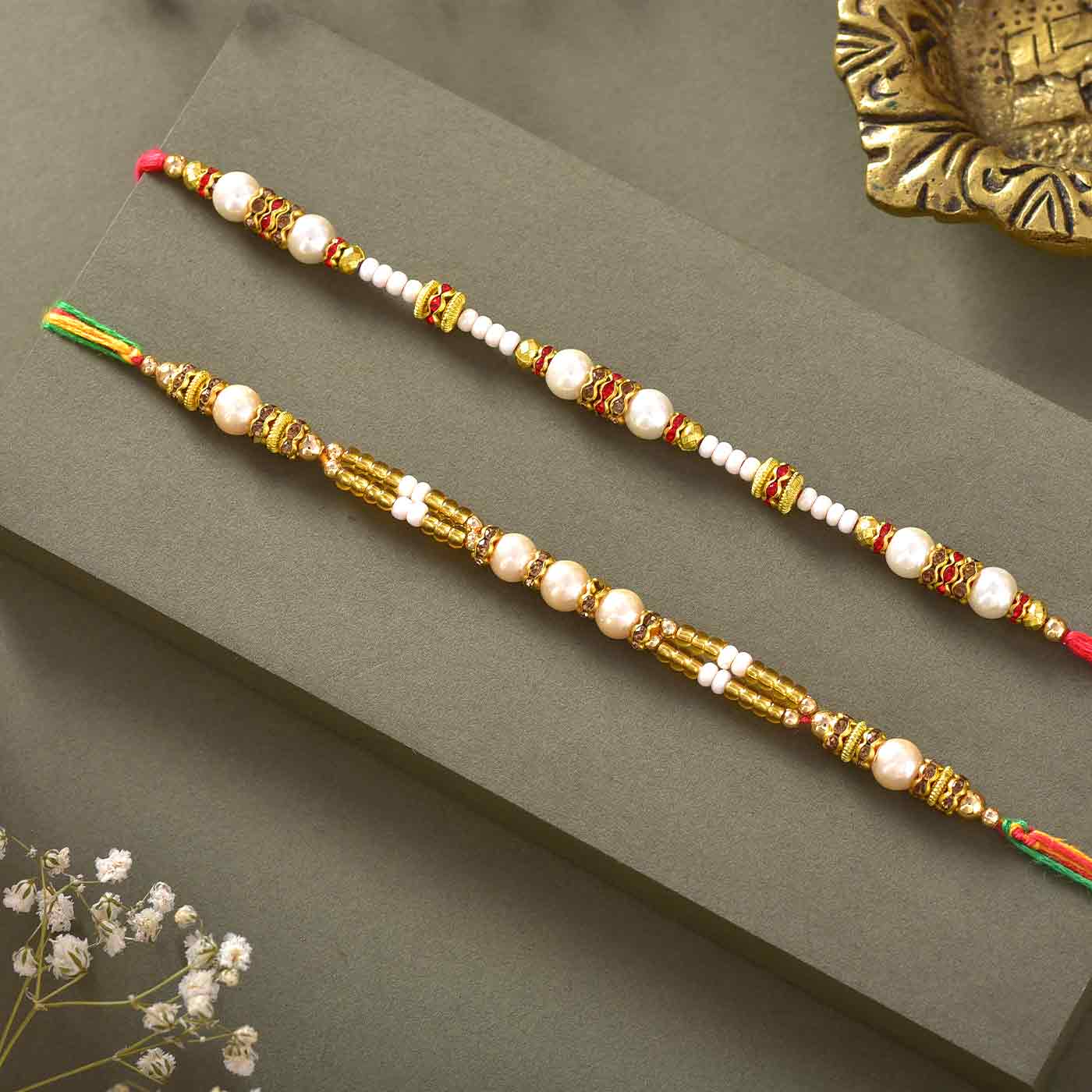 Classy Pearls & Beads Rakhis Set Of 2 with  225 gm kaju 3pc ferrero rocher katli and
