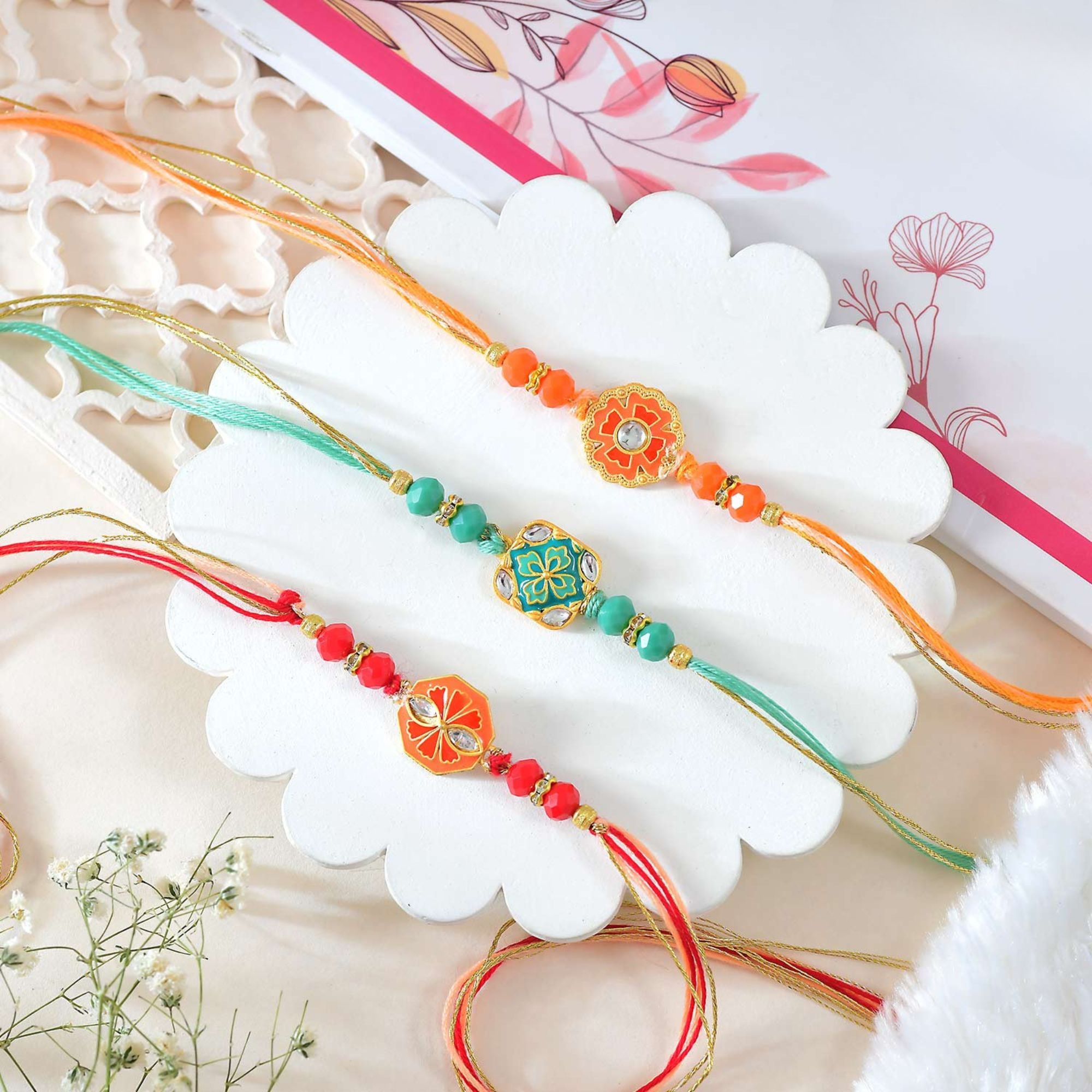 Set of 3 Enchanting Rakhi. Set of 3 Enchanting Rakhi.