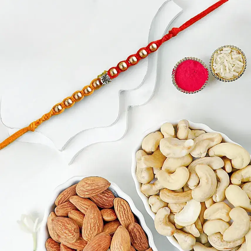 Red & Yellow Fancy Rakhi With Cashew & Almonds Red & Yellow Fancy Rakhi With Cashew & Almonds