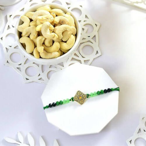 Ethnic Green Beaded Rakhi with Cashews Ethnic Green Beaded Rakhi with Cashews