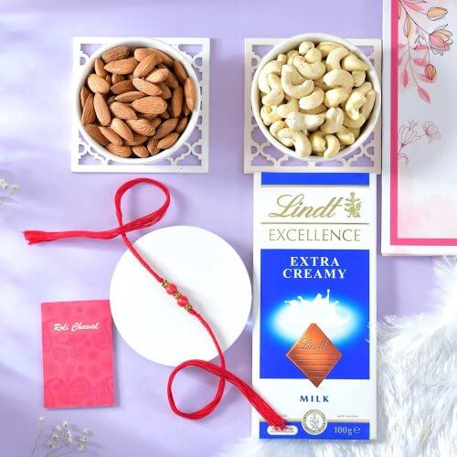 Beaded Red Rakhi with Lindt Chocolate and Dry Fruits Beaded Red Rakhi with Lindt Chocolate and Dry Fruits