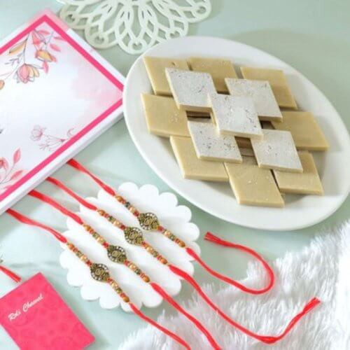 Om Rakhi Set Of 4 With Kaju Katli