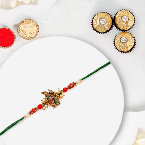 Sneh Gold Radha Krishna Pearl Rakhi With 3 Pcs Ferrero Rocher