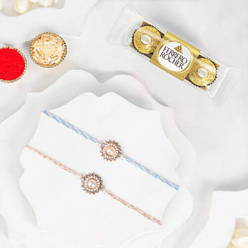 Classic Pearl Rakhi Duo With Ferrero Rocher 3 Pcs Classic Pearl Rakhi Duo With Ferrero Rocher 3 Pcs