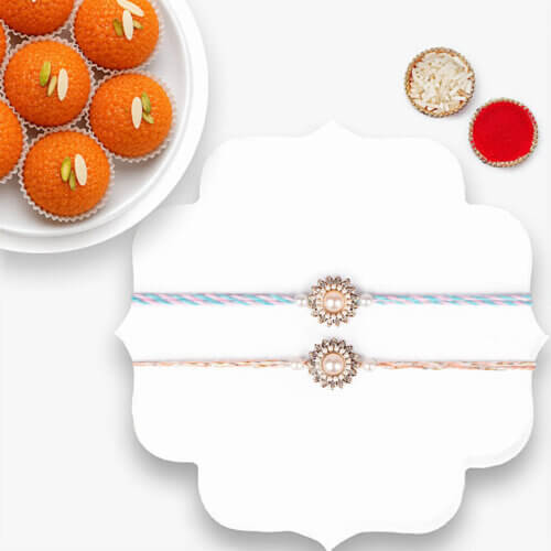 Classic Pearl Rakhi Duo With Motichoor Laddoo Classic Pearl Rakhi Duo With Motichoor Laddoo