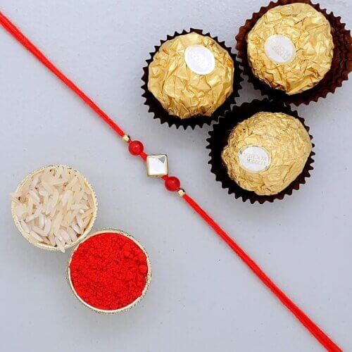 Designer Round Rakhi And 3 Pcs Ferrero Rocher Designer Round Rakhi And 3 Pcs Ferrero Rocher