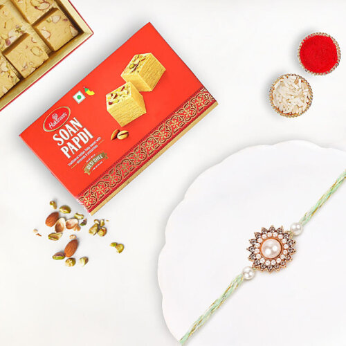 Gold Floral Pearl Rakhi With Soan Papdi Gold Floral Pearl Rakhi With Soan Papdi