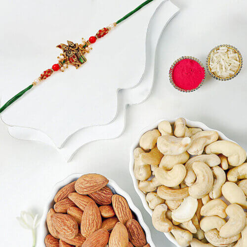 Sneh Gold Radha Krishna Pearl Rakhi With Cashews And Almonds Sneh Gold Radha Krishna Pearl Rakhi With Cashews And Almonds